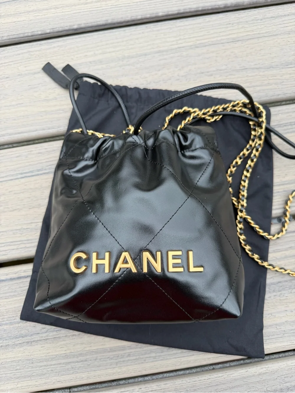 CHANEL Black Quilted Leather Drawstring Crossbody with Gold Chain